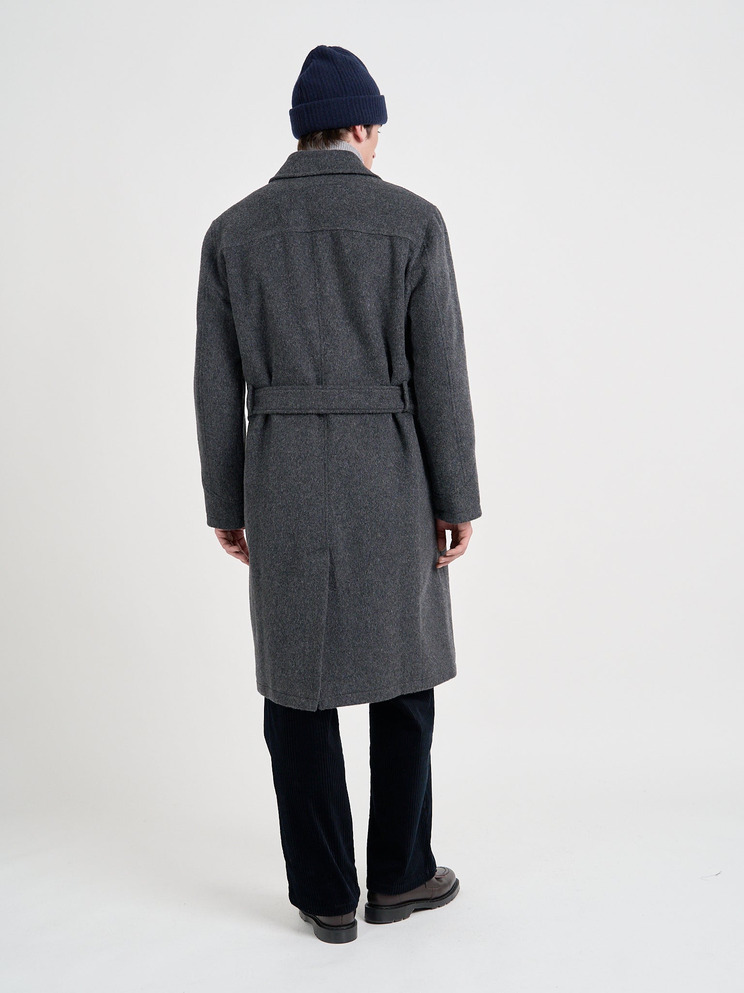 Back shot of model wearing Men's Charcoal Recycled Wool And Mohair Trench Coat