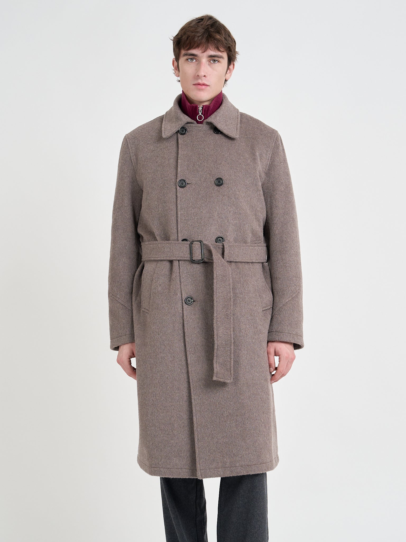 Detailed shot of model wearing Oliver Spencer Men's Taupe Double-Breasted Wool Trench Coat.
