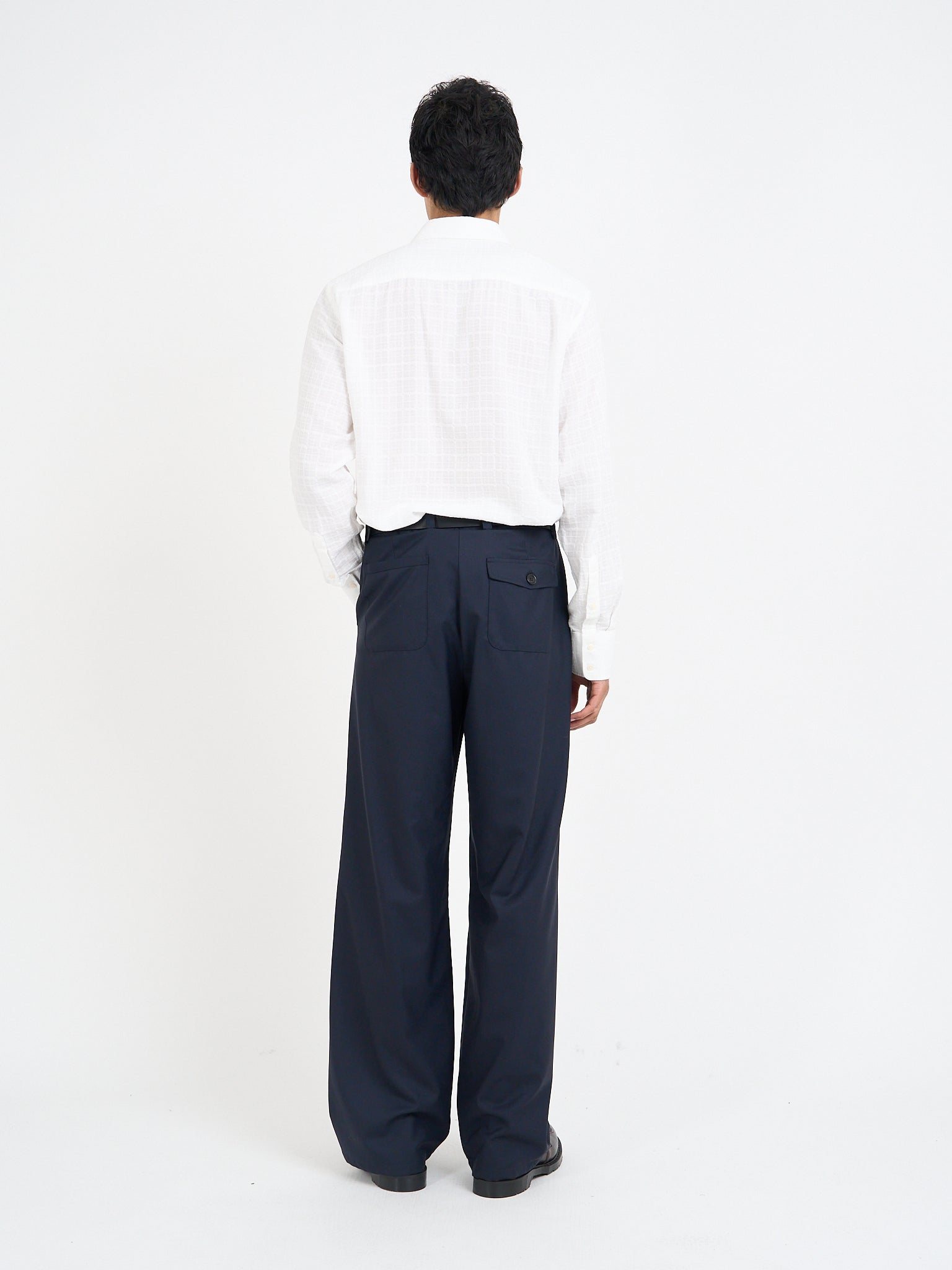 Rear view of Orsman trousers in navy tropical wool