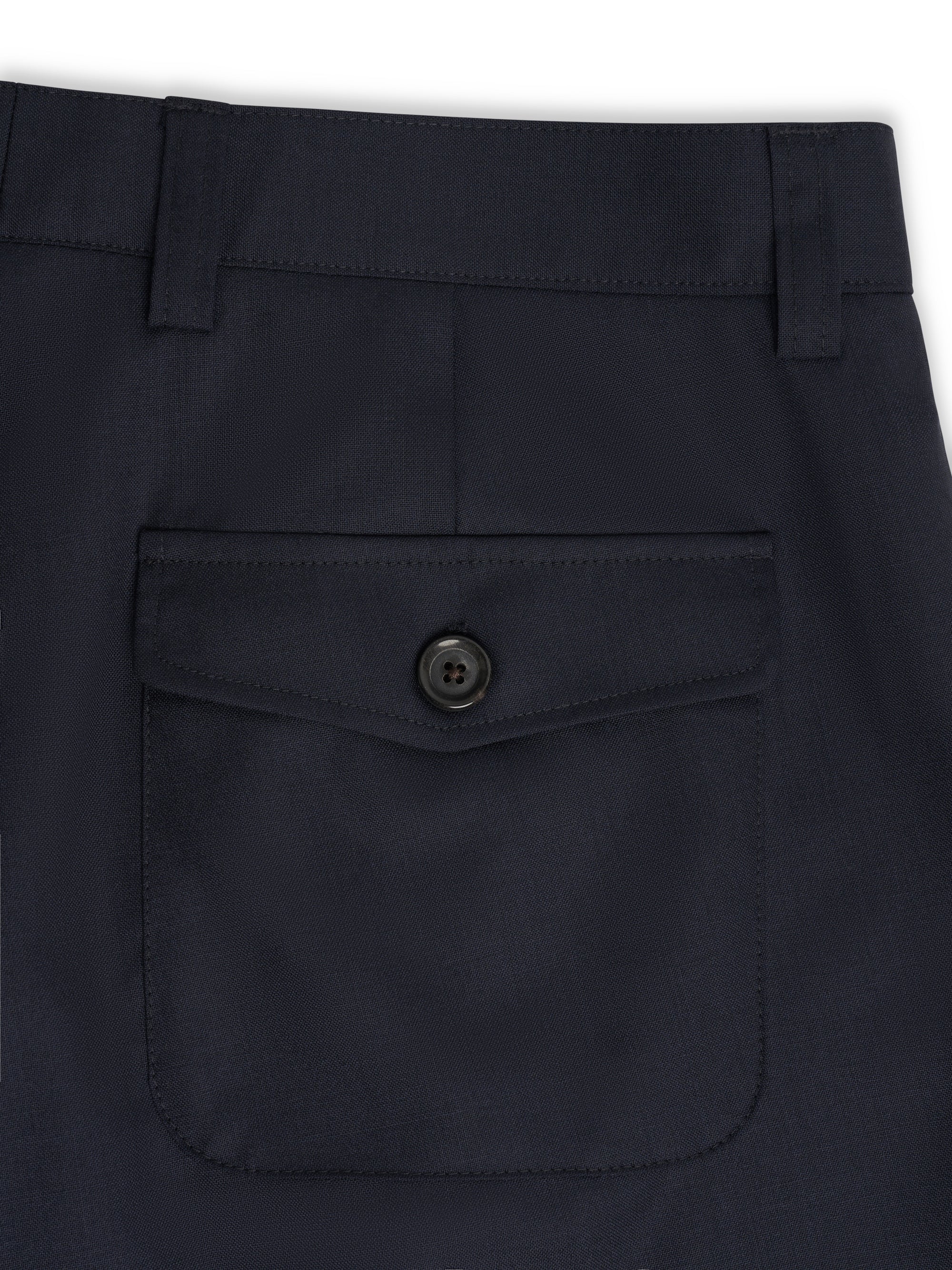 Rear patch pocket detail on Orsman Miro navy wide-leg trousers