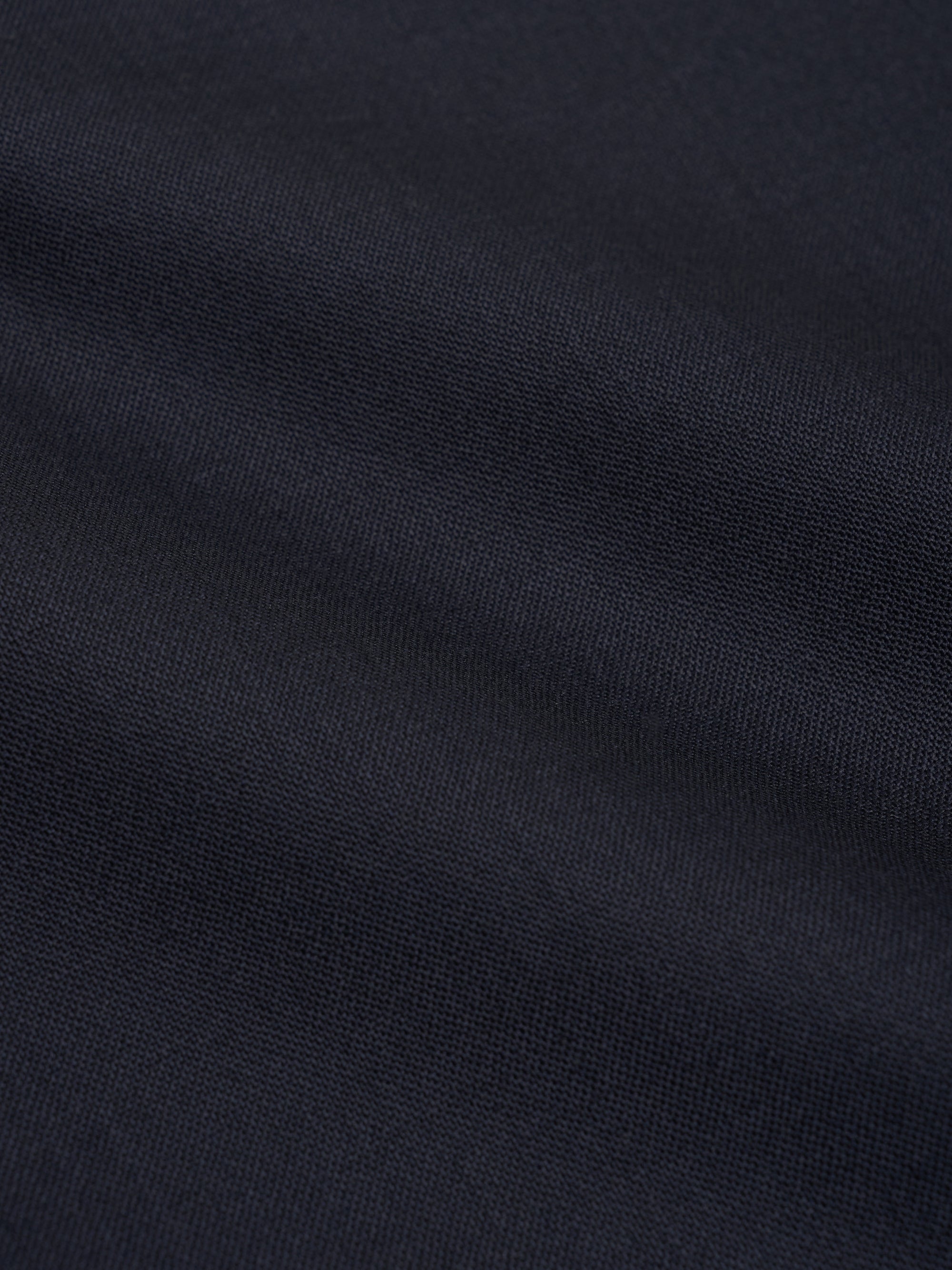 Close-up of navy tropical wool fabric used on Orsman trousers