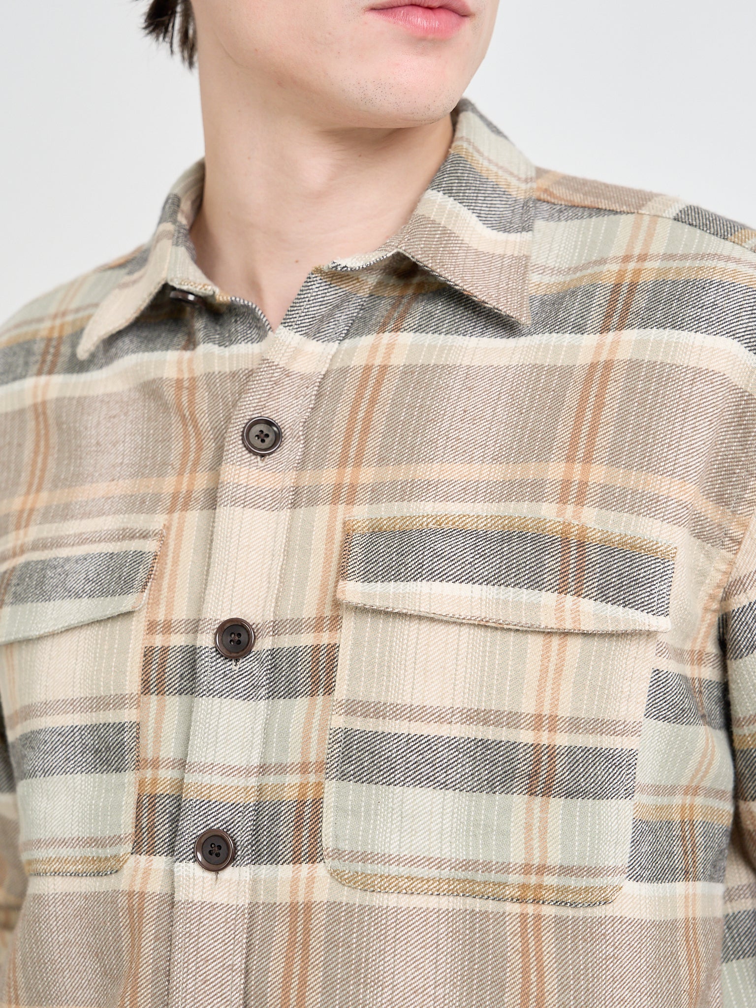 Close up collar shot of model wearing an Oliver Spencer Men's Beige Brushed Cotton Check Overshirt
