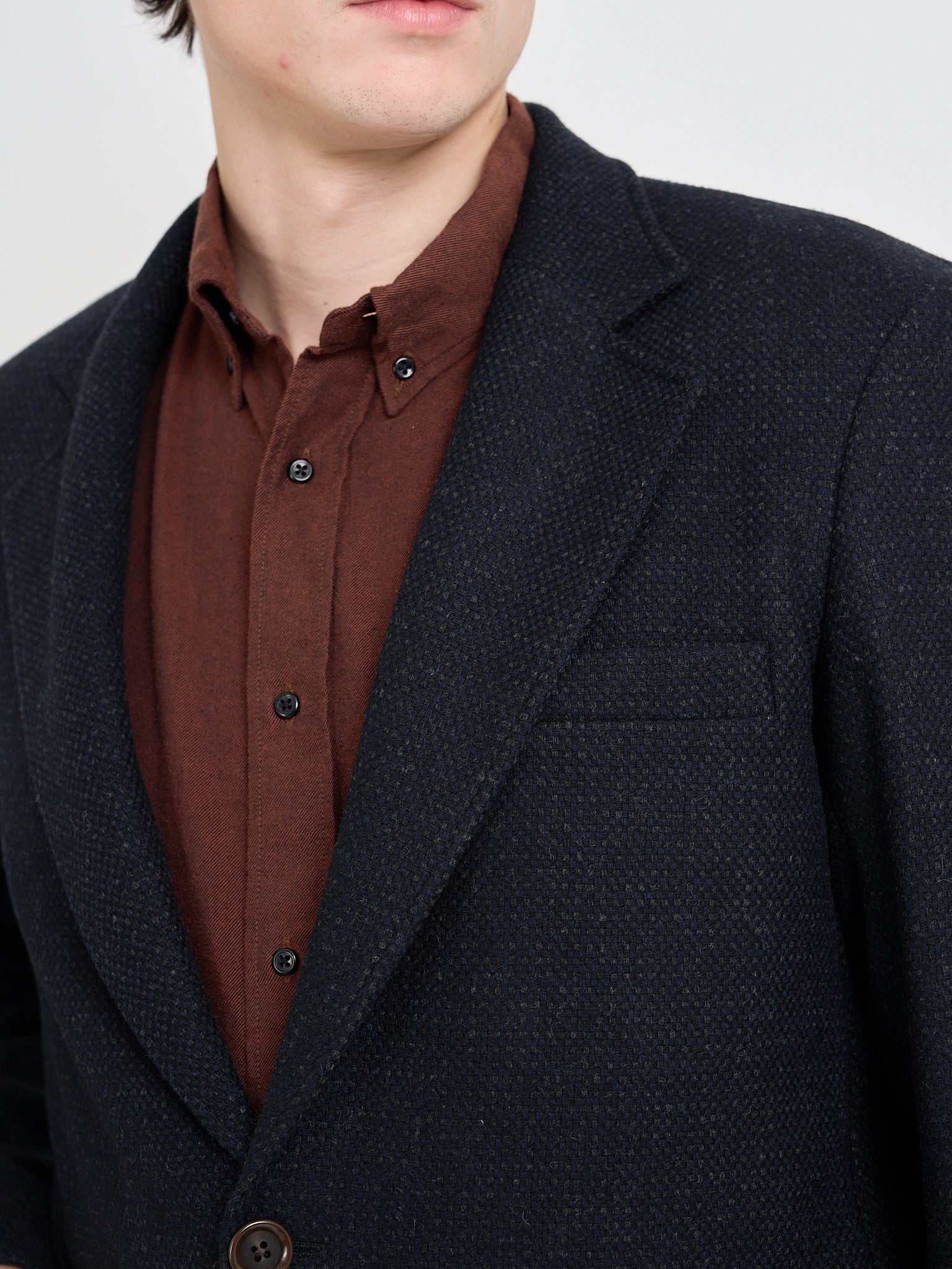 Detailed close up shot of model wearing Oliver Spencer Men's Black Wool Single-Breasted Black Jacket