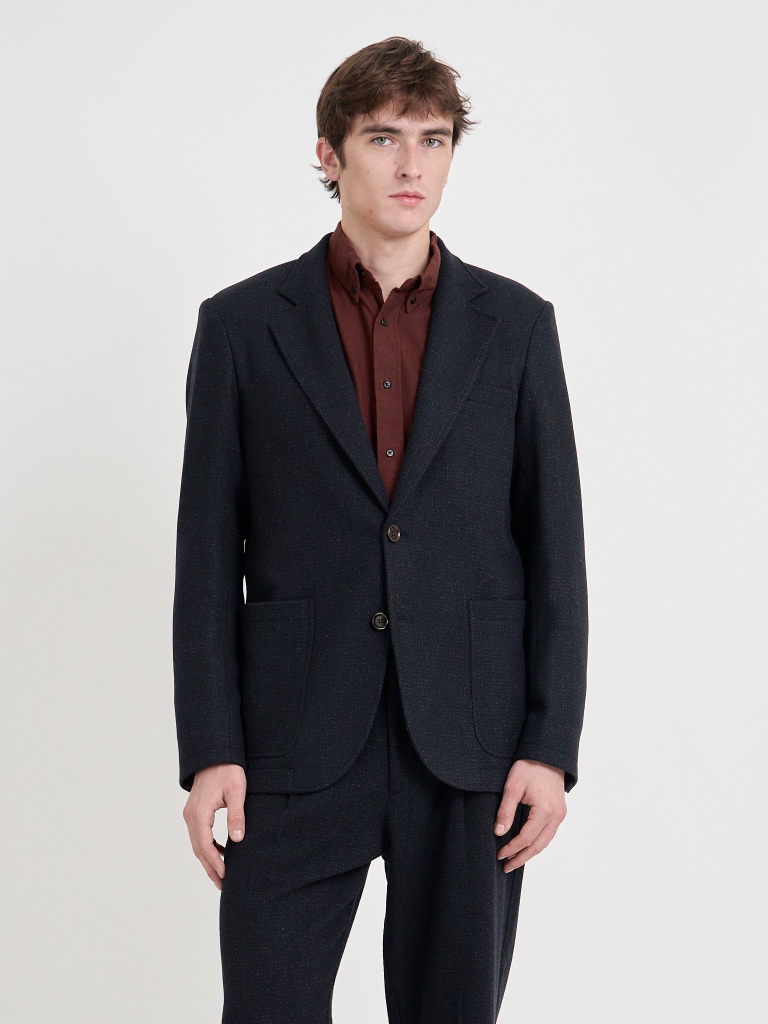 Detailed close up shot of model wearing Oliver Spencer Men's Black Wool Single-Breasted Black Jacket