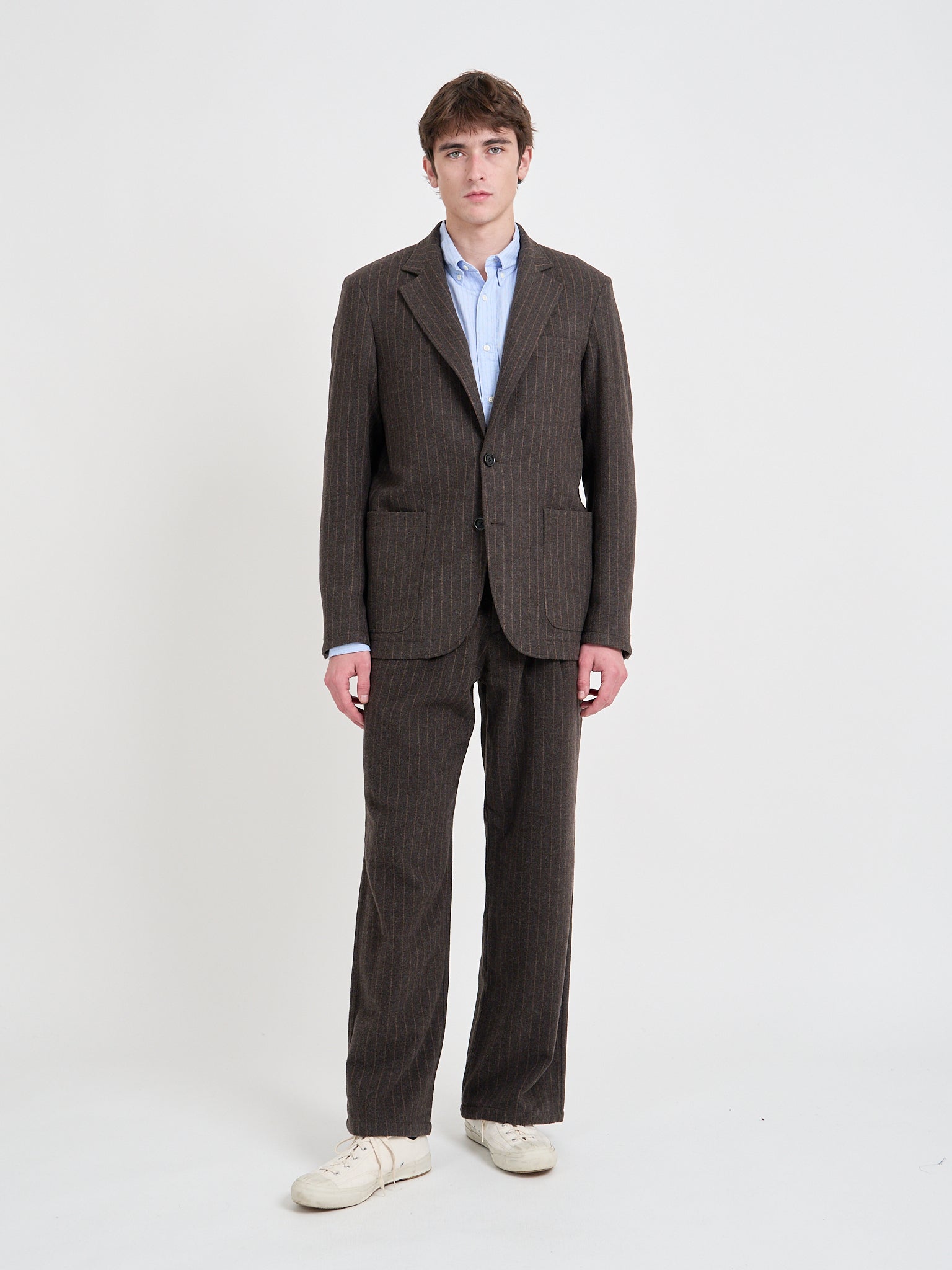 Model wearing Oliver Spencer Men's Single-Breasted Brown Striped Blazer