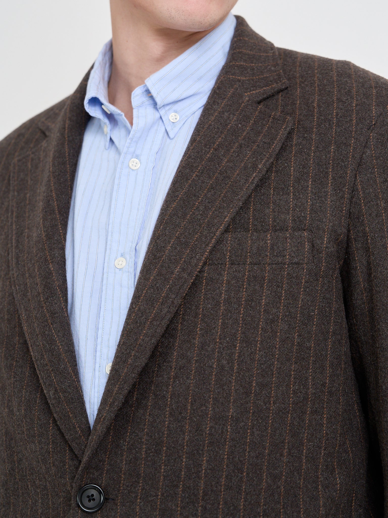 Close up shot of model wearing Oliver Spencer Men's Single-Breasted Brown Striped Blazer